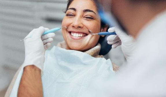 teeth whitening centennial | woman at dentist