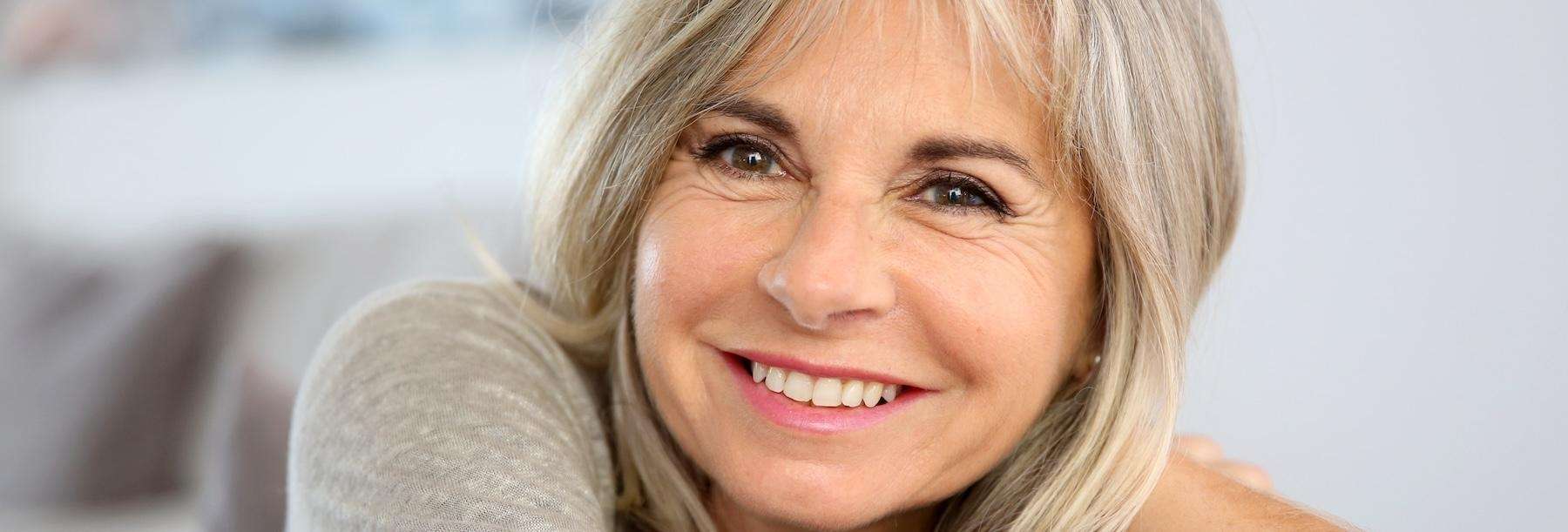 dental crowns centennial | woman smiling