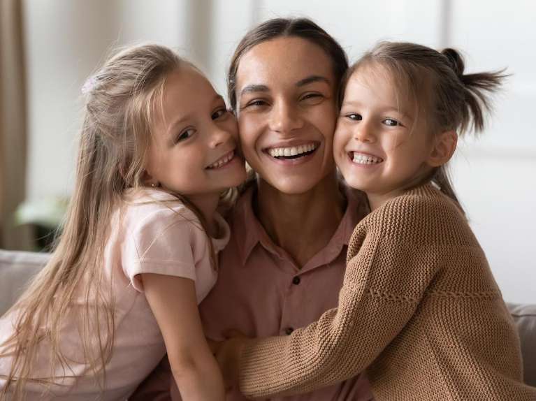 mom and her daughters at the dentist in centennial
