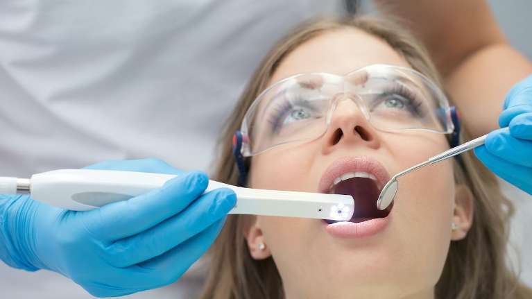 woman receiving dental treatment | dentist centennial co