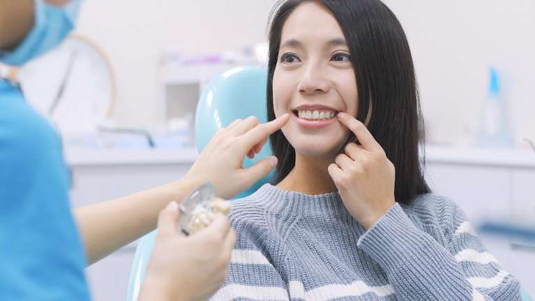 patient discussing full smile makeover in centennial, co