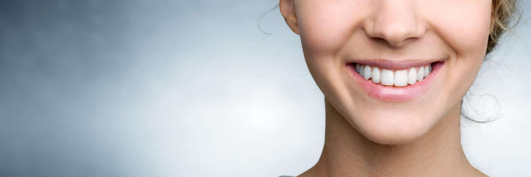 woman smiling after her dental appointment in centennial 