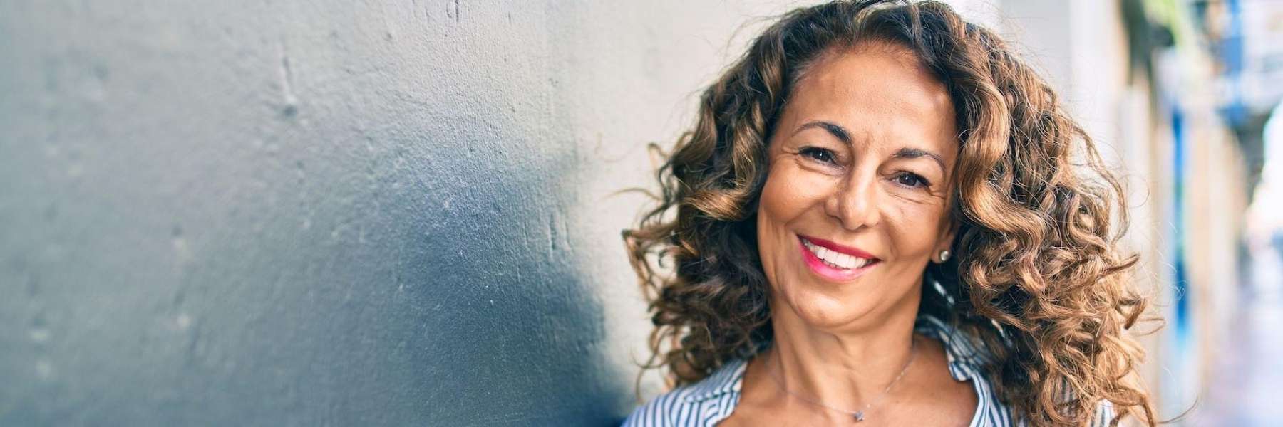 woman who got dental implants in centennial