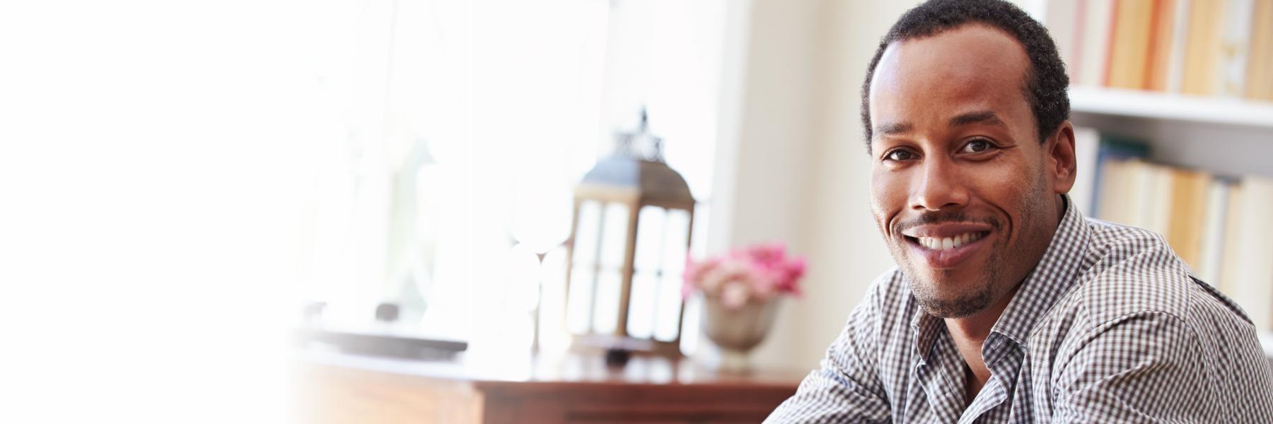 Man smiling with dental implants in Centennial, CO