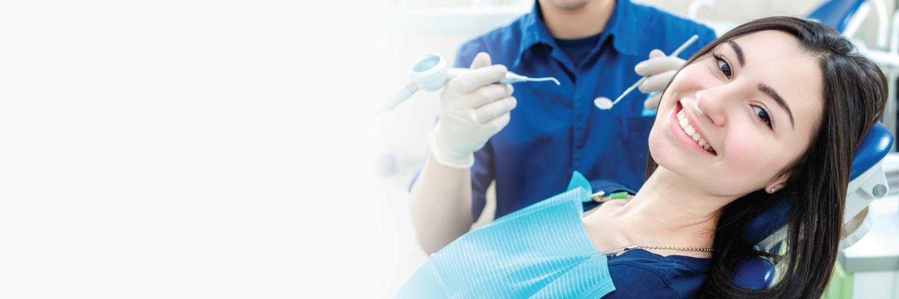 dental fillings centennial | woman at dentist