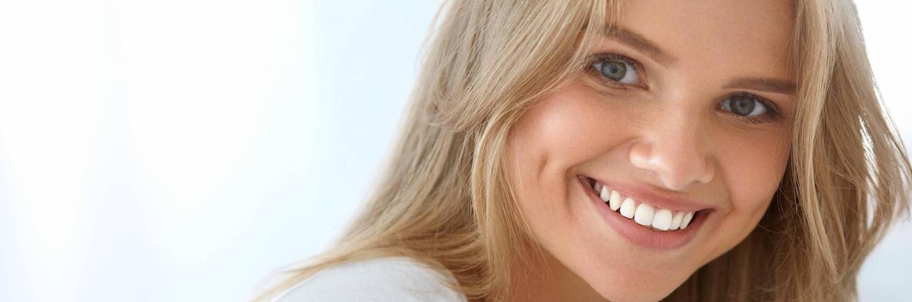 porcelain veneers centennial co | woman smiling